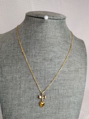 Avon Bow Station dangle pendant With a heart-shaped citrine crystal VTG